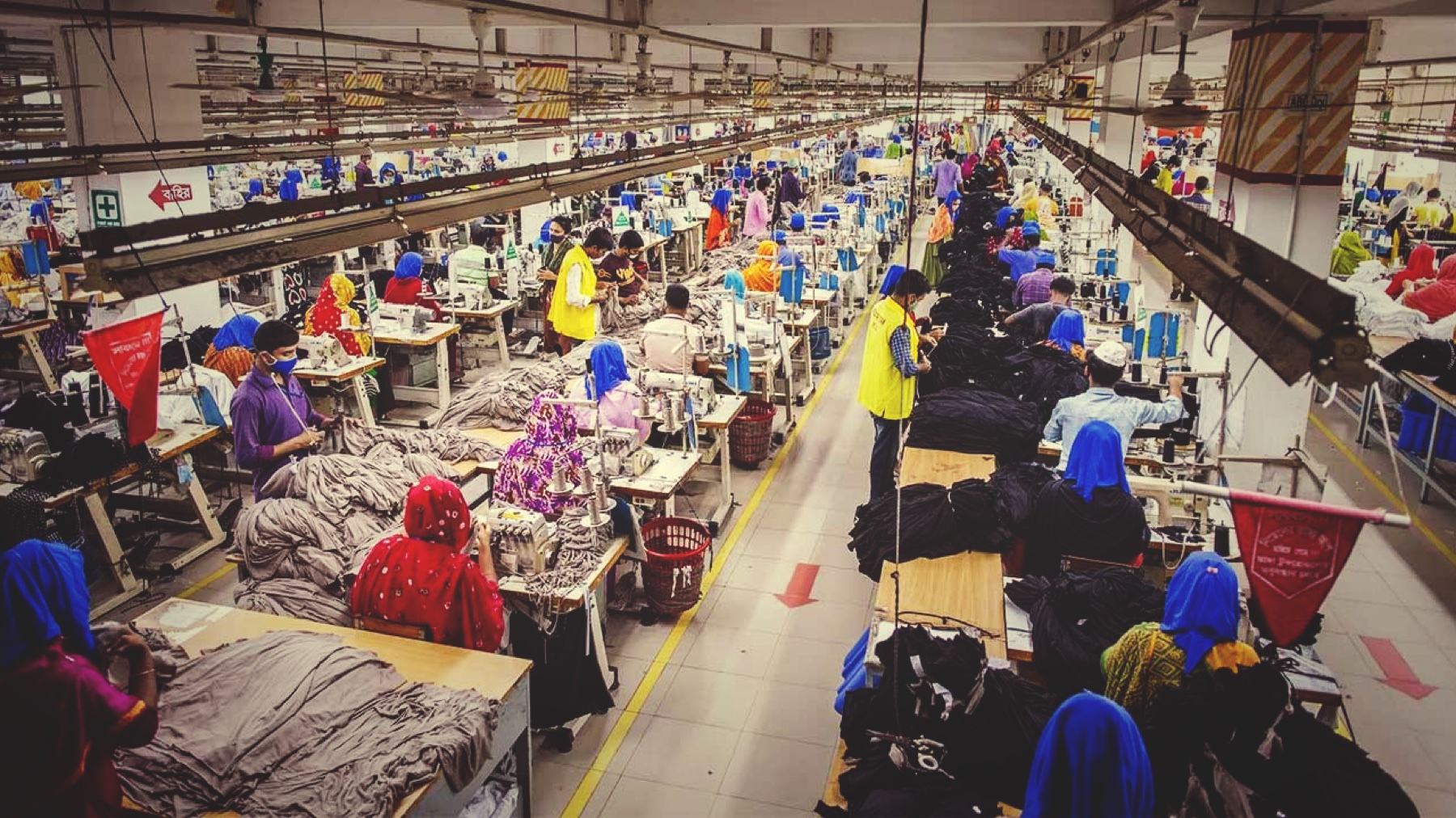 Large ready-made garment production floor with many sewing lines and operators